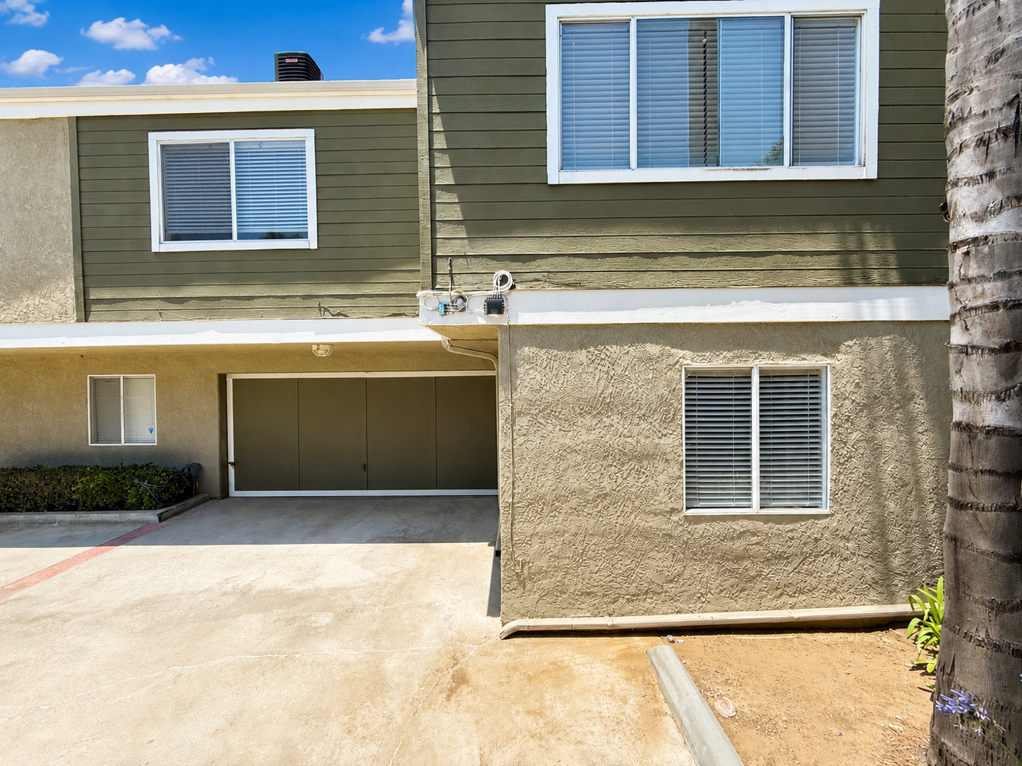 Attached garage and gated entry area